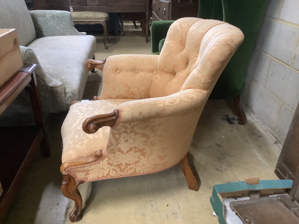 A Victorian walnut button back armchair, width 77cm